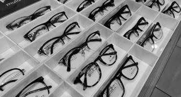 Bekasi, Indonesia on December 12 2023. Several glasses are neatly arranged in an glasses shop window. photo