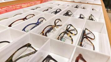 Bekasi, Indonesia on December 12 2023. Several glasses are neatly arranged in an glasses shop window. photo