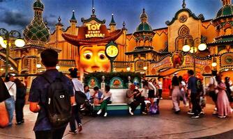 Chiba, Japan on September 30, 2023. Visitors to the Toy Story Mania ride at night. photo