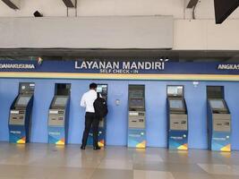 Jakarta, Indonesia on July 7 2022. Airplane passengers who are self-checking in at the machine available at Halim Perdanakusuma Airport. photo