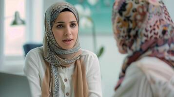 A Muslim woman doctor in a hijab, talking to a patient. Close-up portrait. The concept of medicine, mental health, diversity. Background with a bokeh effect. photo