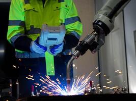 Steel robot metal technology machinery industry arm hand finger equipment manufacturing engineering production futuristic automate work business control tool welding part toll science computer spark photo