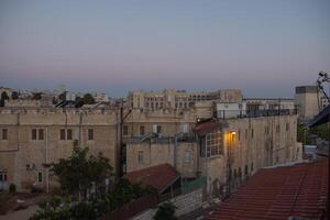 Early morning in the Jerusalem. Sunrise time. City view. Old buildings. Clouds on the sky. Selective focus photo