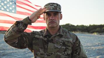 Military standing at attention next to the flag of their nation photo