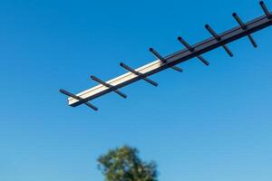 Aerial TV Antenna with clear blue sky photo