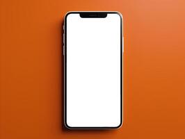 Blank white screen phone on clean dark orange background photo