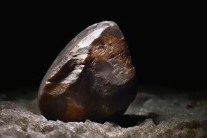 Yeelimite fossil mineral stone. Geological crystalline fossil. Dark background close-up. photo