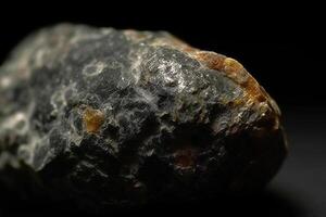 Mundite fossil mineral stone. Geological crystalline fossil. Dark background close-up. photo