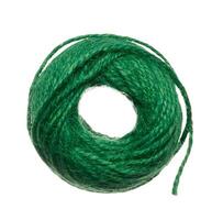 Skein of green thread on a white isolated background photo