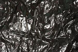Crumpled black polyethylene, full frame photo