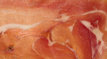 Thinly sliced jamon, top view photo