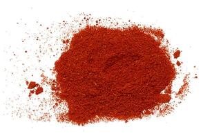 Scattered pile of smoked ground red paprika photo