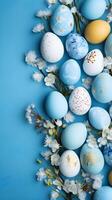 Colorful eggs with copyspace on blue background. Easter egg concept, Spring holiday photo