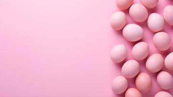 Colorful eggs with copyspace on pink background. Easter egg concept, Spring holiday photo