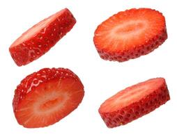 Pieces of ripe red strawberries on isolated background photo