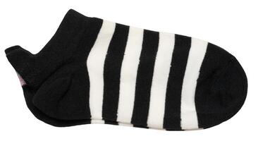 Black and white striped textile socks on isolated background photo