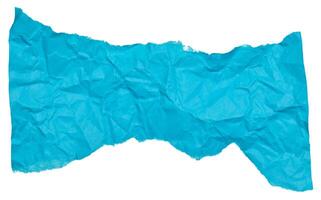 Torn piece of blue paper on a white isolated background photo