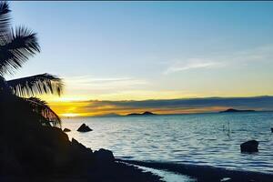 Art Beautiful sunset over the tropical beach photo
