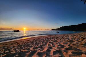 Art Beautiful sunset over the tropical beach photo