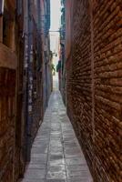 Typical Venetian architecture and street view from Venice, Italy. photo