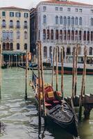 Venice, Italy - april 2,2023. Venice Grand Canal, tourists riding gondolas photo