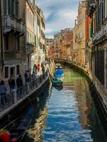 Venice, Italy - april 2,2023. Venice Grand Canal, tourists riding gondolas photo