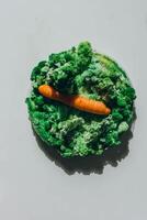 Orange carrots with mold and moss. photo