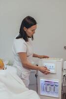 Cosmetologist esthetician performs skin treatment and rejuvenation photo