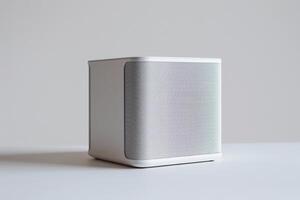 A computer speaker set with a sleek, minimalist design, showcased against a pure white canvas photo