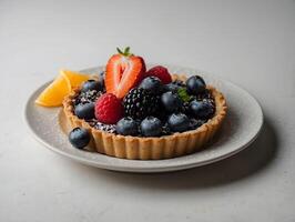 Delicious tartlet with berries on white table, closeup view photo