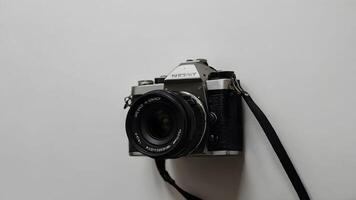 Old retro camera on a white background. Selective focus. Photo. photo