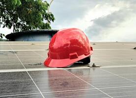 Plastic safety helmet isolated on panel surya background photo