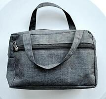 bolsa o bolso tela con gris color en blanco antecedentes foto