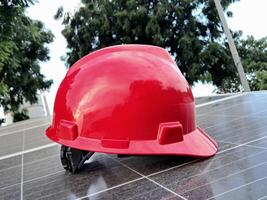 Plastic safety helmet isolated on panel surya background photo