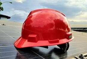 Plastic safety helmet isolated on panel surya background photo