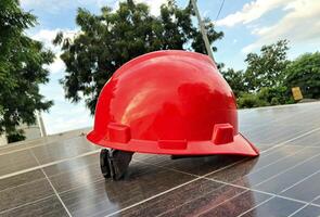 Plastic safety helmet isolated on panel surya background photo