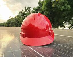 Plastic safety helmet isolated on panel surya background photo