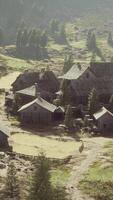 Old wooden village on the rocky mountain background video