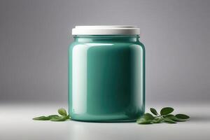 a green jar with a lid and leaves on a table photo