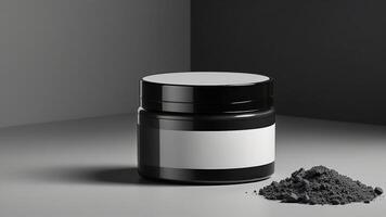 a jar of charcoal powder next to a black container photo