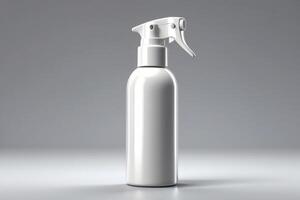 a white spray bottle with a spray nozzle on a gray background photo