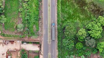 Truck on highway passing bridge video