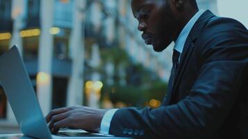 black businessman using computer laptop photo