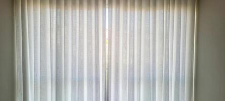 Radiant and welcoming, this sunlit house curtain creates a warm and inviting atmosphere. Purchase this image and illuminate your projects with luminosity and comfort photo