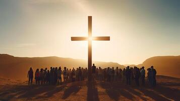 Silhouettes of people next to large cross. Yellow and golden rays of bright light. Crowd with Christian symbol. photo