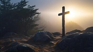 Cross in midst of misty forest. Christian symbol among rocks and trees. Concept of finding the way and faith. photo