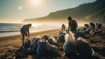 Volunteers clean up on beach. Group of people with plastic bags at work on seashore. Oceanic natural landscape and problem of ecology. Environmental pollution. photo