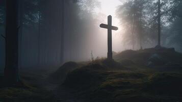 Cross in midst of misty forest. Christian symbol among rocks and trees. Concept of finding the way and faith. photo