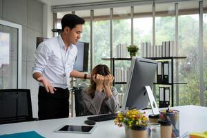 Stressed of female employee and offensive faces that the boss yells, Workplace Conflict, Corporate Communication Problem, stress of business partner discussing, Quarrels, And Bad Attitude At Work photo