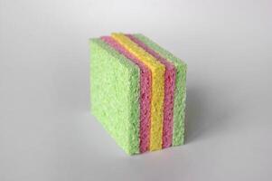 Bright colored sponges for washing dishes, cleaning the bathroom and other household needs. photo